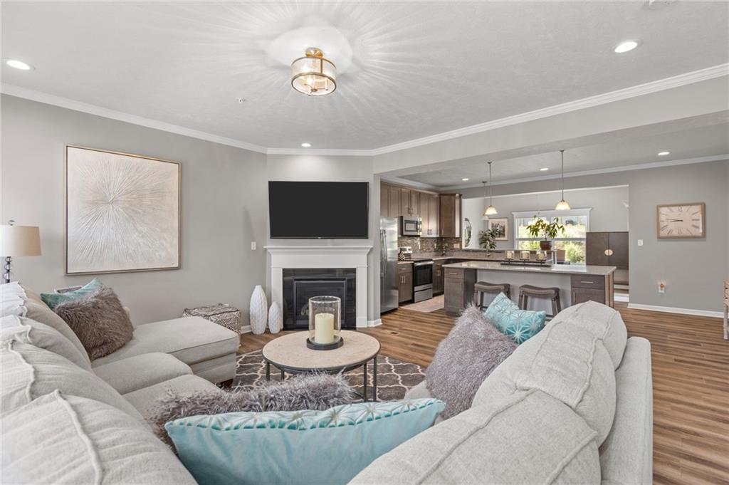 217 Lockheed Drive Coraopolis, PA 15108 - Photo 13 of 27 a living room with furniture a fireplace and a flat screen tv