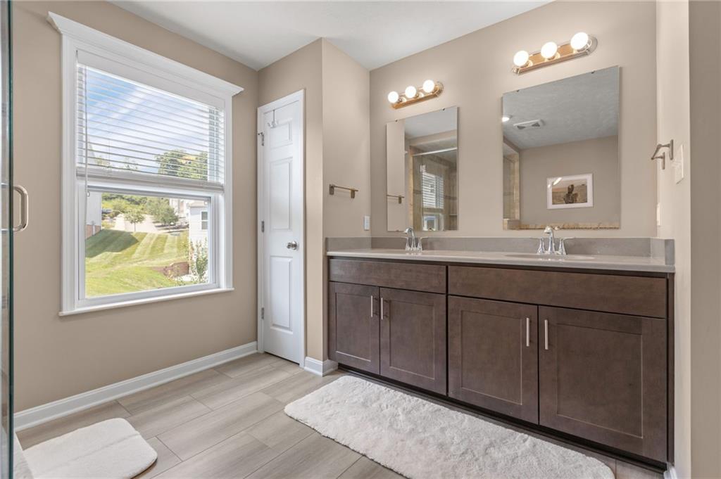 217 Lockheed Drive Coraopolis, PA 15108 - Photo 18 of 27 a bathroom with a granite countertop sink and a mirror
