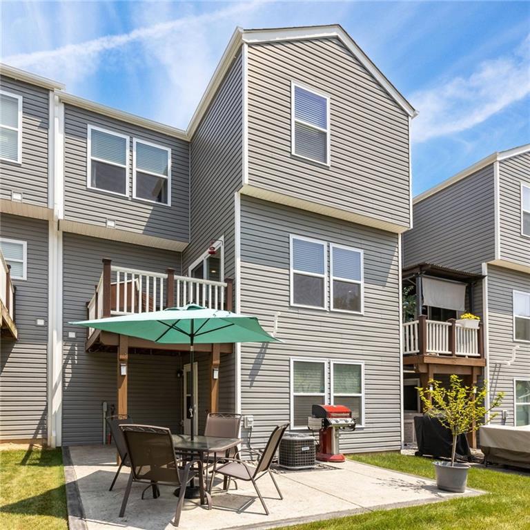 217 Lockheed Drive Coraopolis, PA 15108 - Photo 25 of 27 a front view of a house with garden and plants