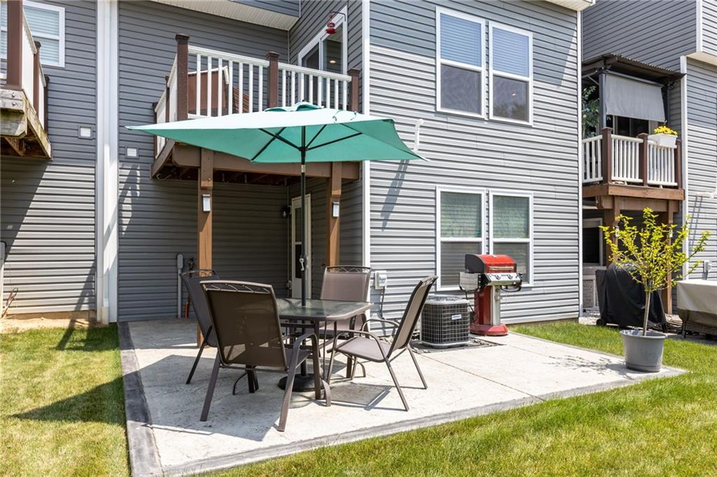 217 Lockheed Drive Coraopolis, PA 15108 - Photo 26 of 27 a view of a chairs and table in backyard of the house