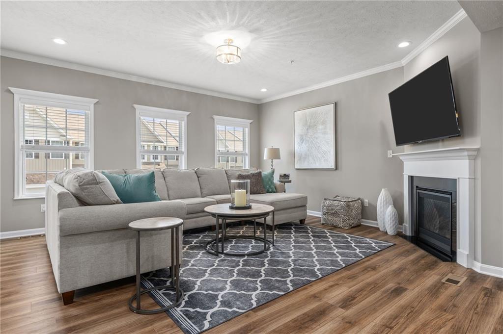 217 Lockheed Drive Coraopolis, PA 15108 - Photo 9 of 27 a living room with furniture a flat screen tv and a fireplace