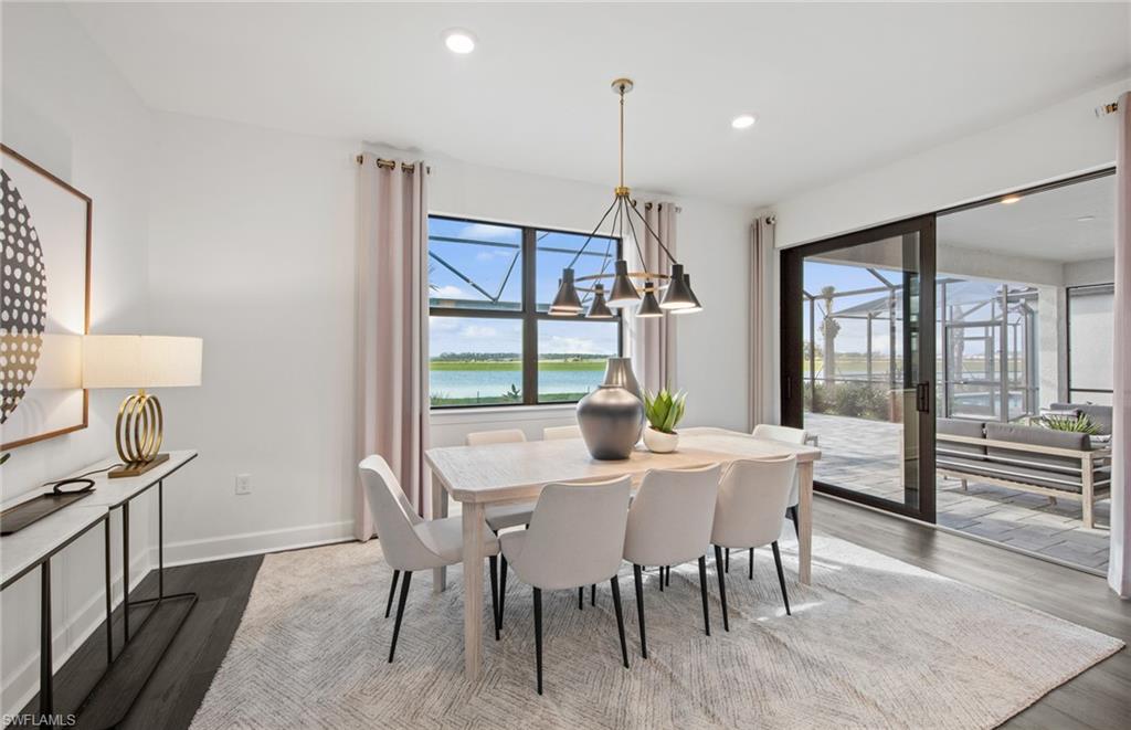 19061 Gentry Place Estero, FL 33928 - Photo 12 of 49 a view of a dining room with furniture window and wooden floor