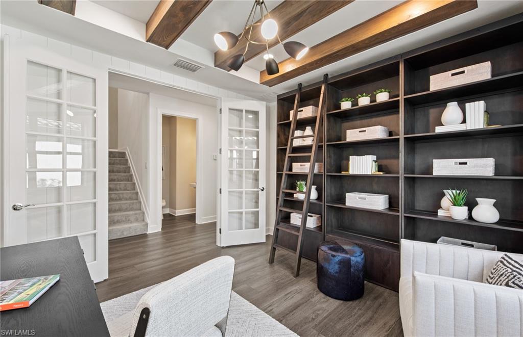 19061 Gentry Place Estero, FL 33928 - Photo 14 of 49 a living room with furniture and a wooden floor