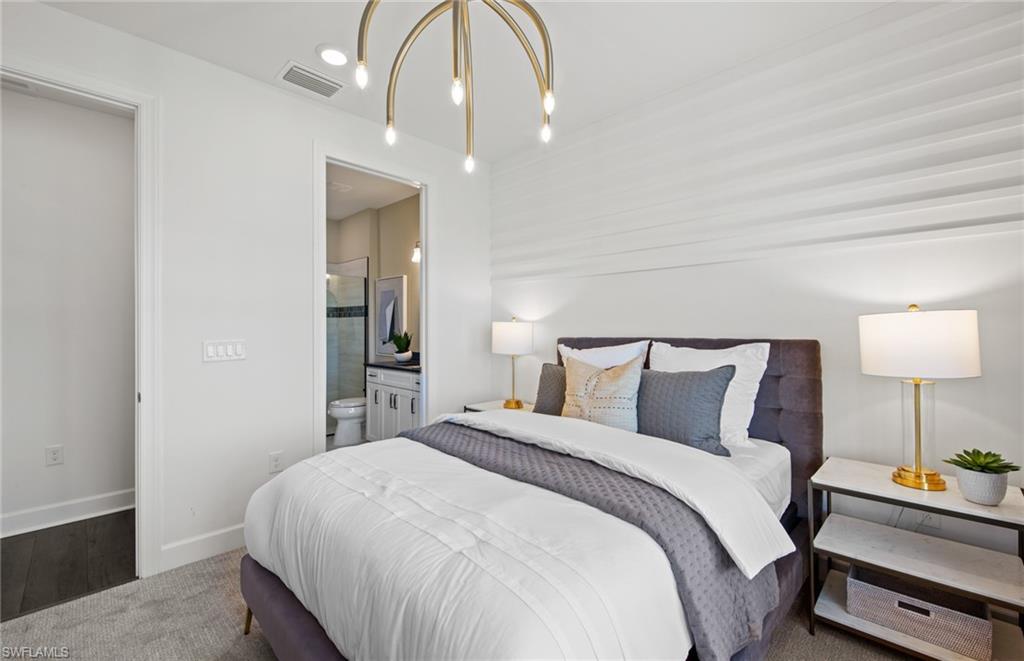 19061 Gentry Place Estero, FL 33928 - Photo 19 of 49 a bedroom with a bed and a lamp