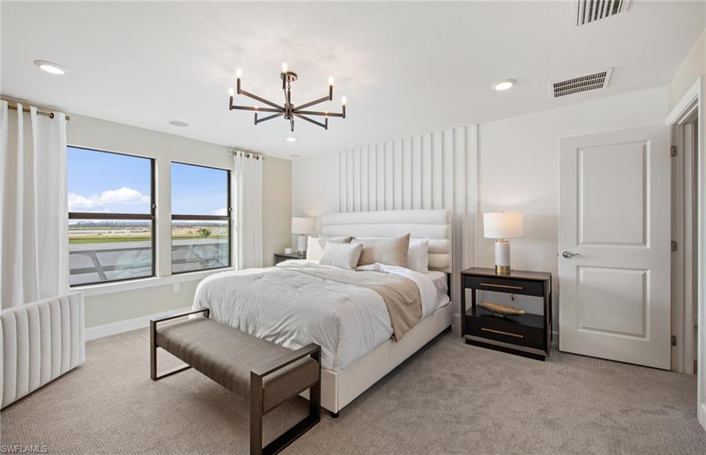 19061 Gentry Place Estero, FL 33928 - Photo 27 of 49 a spacious bedroom with a bed and a window