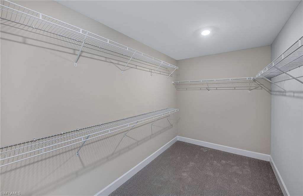19061 Gentry Place Estero, FL 33928 - Photo 33 of 49 a view of an empty walk in closet