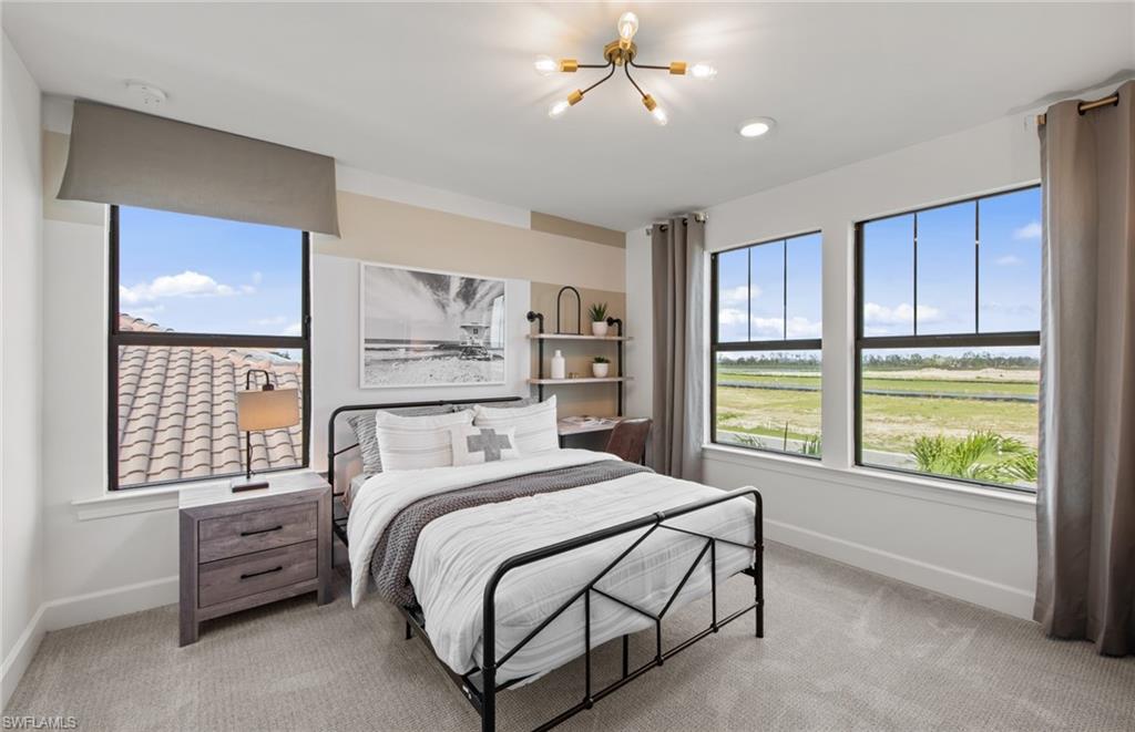 19061 Gentry Place Estero, FL 33928 - Photo 35 of 49 a bedroom with a large bed and a window