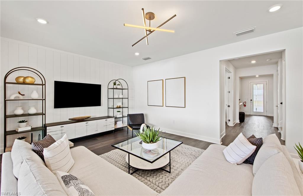 19061 Gentry Place Estero, FL 33928 - Photo 10 of 49 a living room with furniture and wooden floor