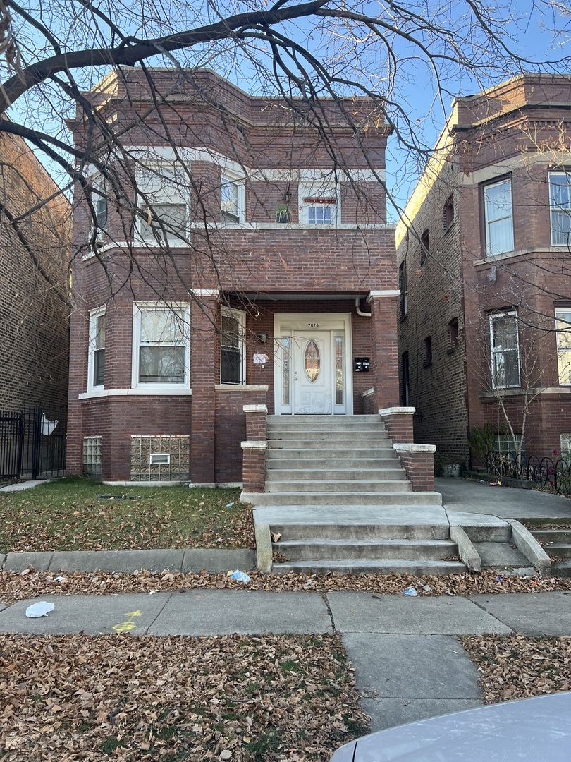 7826 South Morgan Street Chicago, IL 60620 - Photo 1 of 16 a front view of a house with a garden