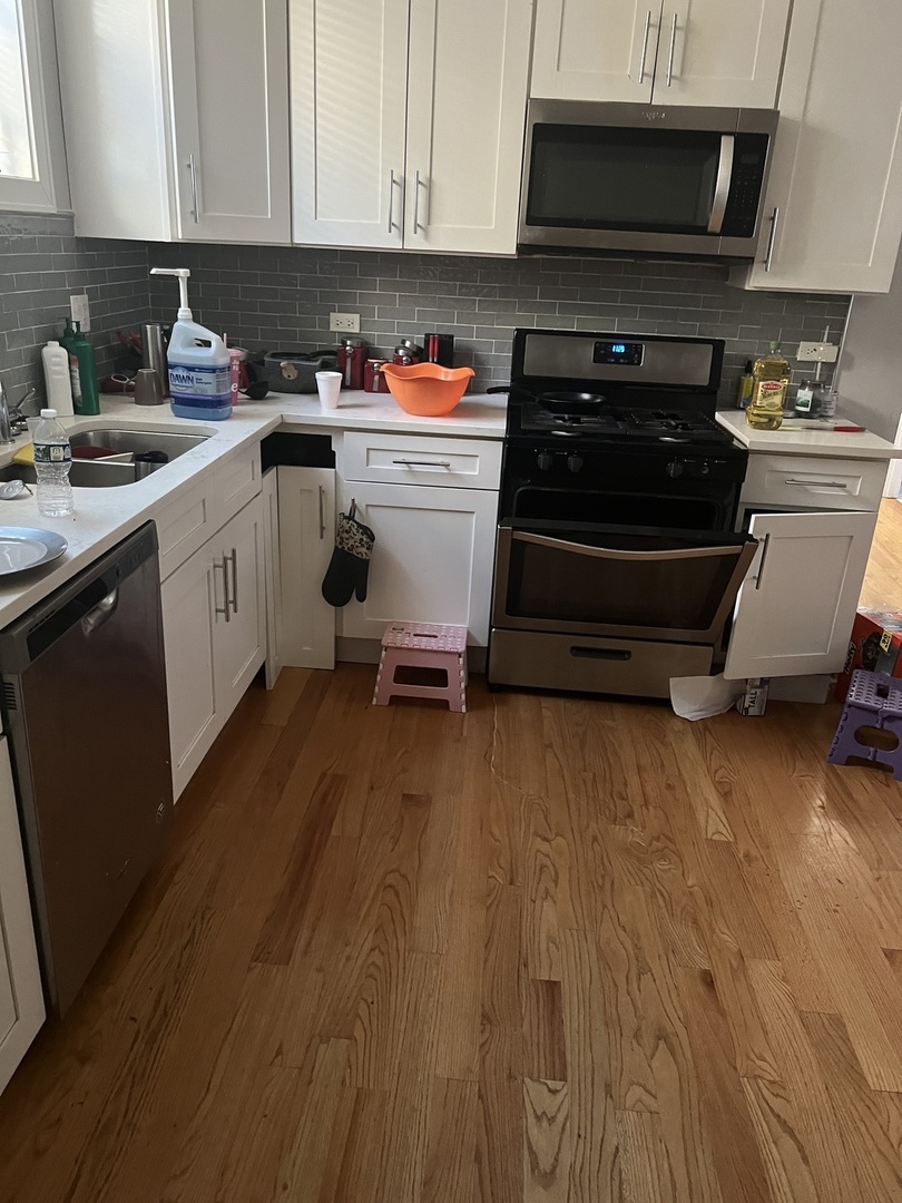 7826 South Morgan Street Chicago, IL 60620 - Photo 11 of 16 a kitchen with a sink and cabinets