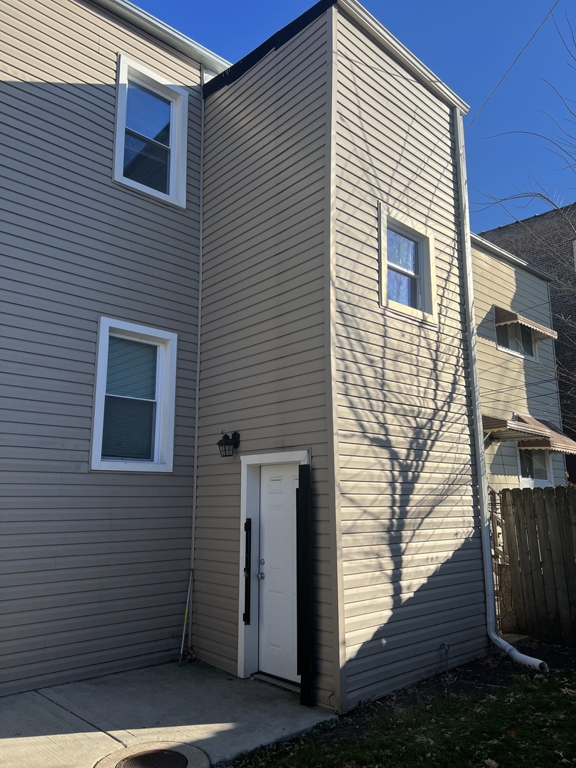 7826 South Morgan Street Chicago, IL 60620 - Photo 15 of 16 a view of a house with wooden deck