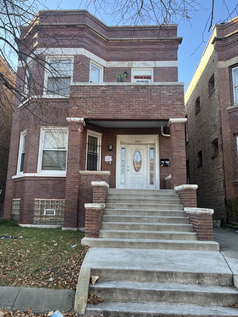 7826 South Morgan Street Chicago, IL 60620 - Photo 3 of 16 a front view of a house with garden