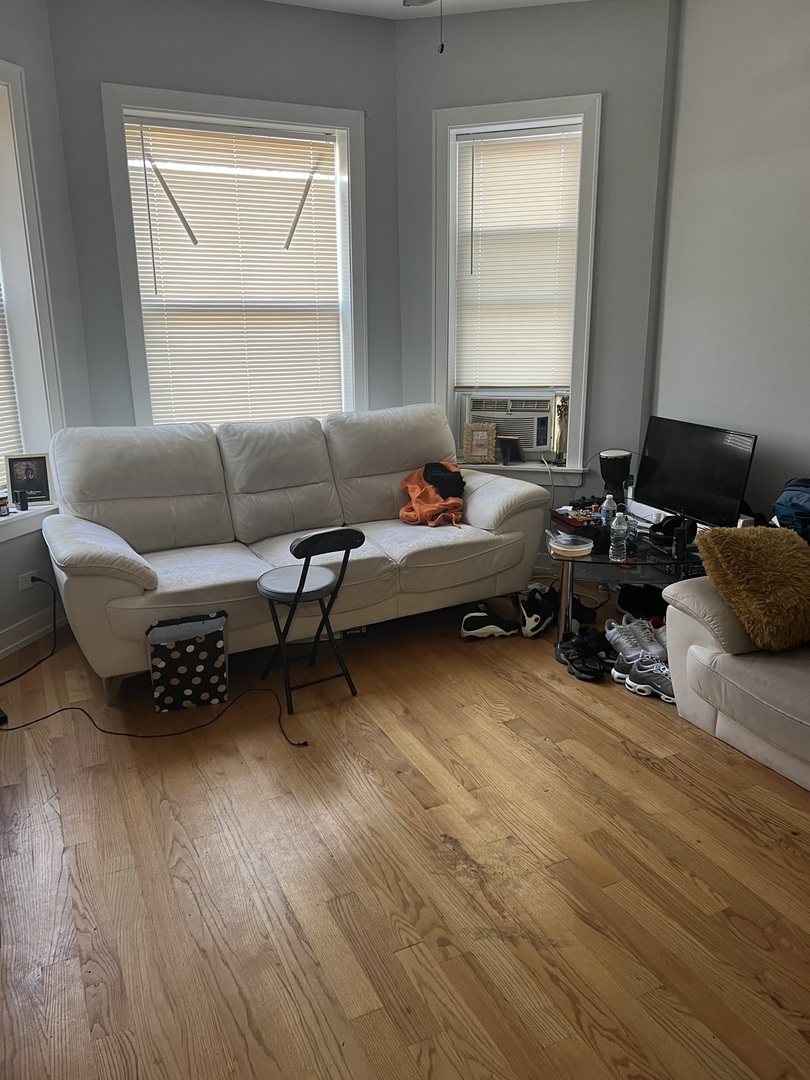 7826 South Morgan Street Chicago, IL 60620 - Photo 7 of 16 a living room with furniture and a window