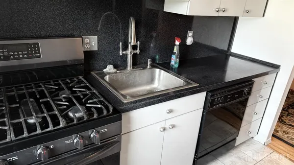 a close view of a stove a microwave oven