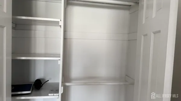 a bathroom with a glass shower door