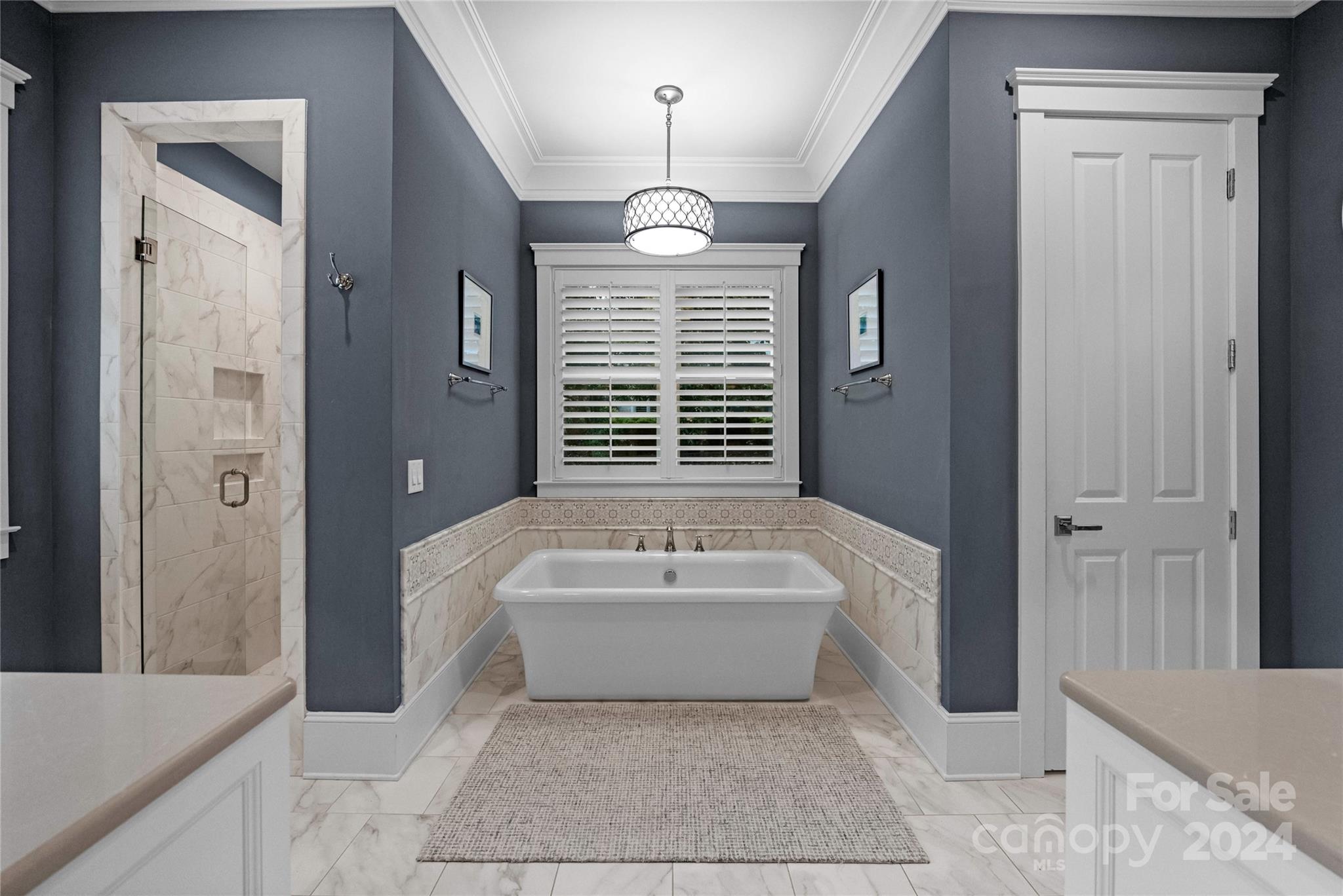 18121 John Connor Road Cornelius, NC 28031 - Photo 16 of 43 a spacious bathroom with a bathtub a window and a shower