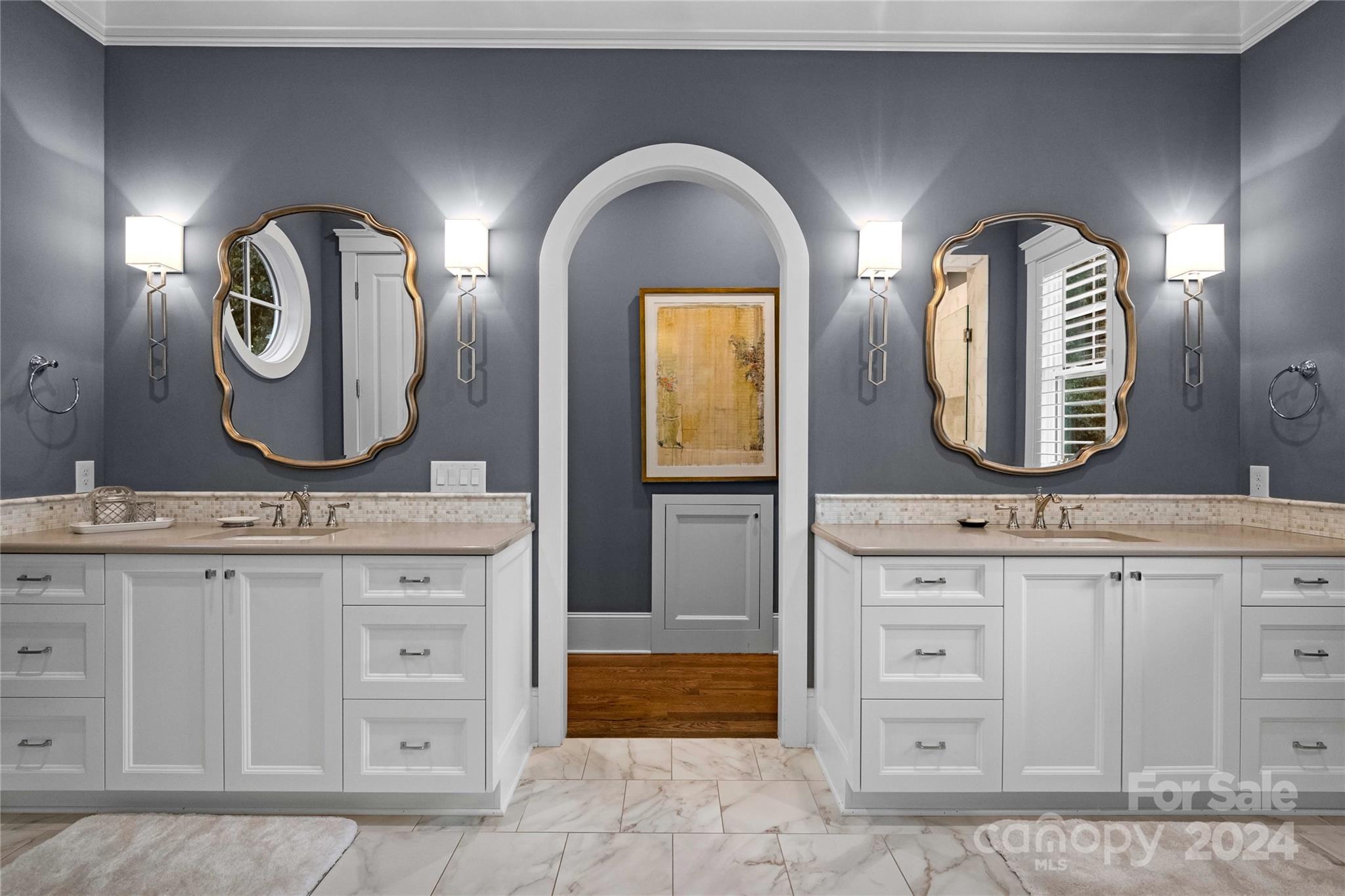 18121 John Connor Road Cornelius, NC 28031 - Photo 18 of 43 a bathroom with a double vanity sink and a mirror