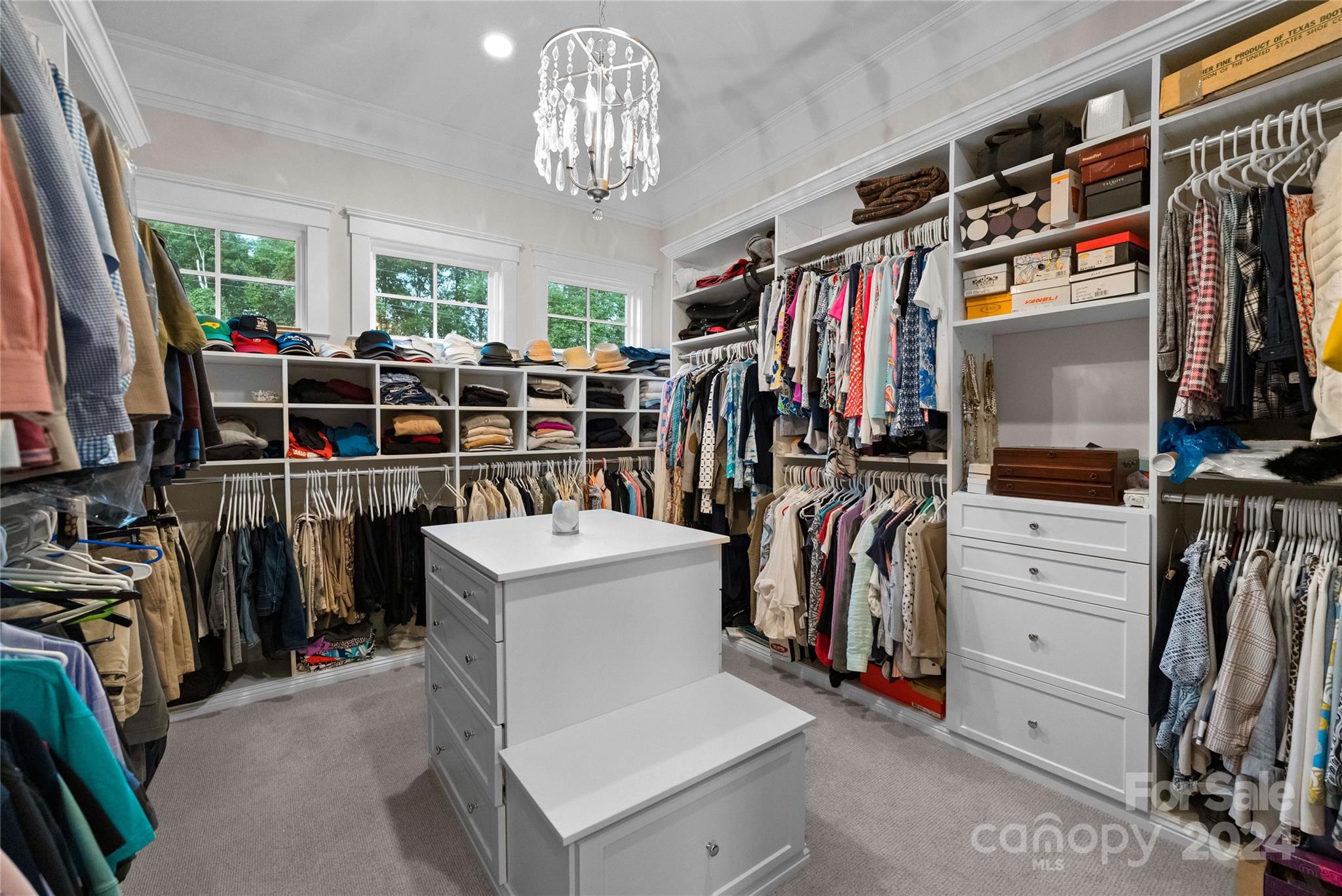 18121 John Connor Road Cornelius, NC 28031 - Photo 19 of 43 a view of walk in closet with clothes