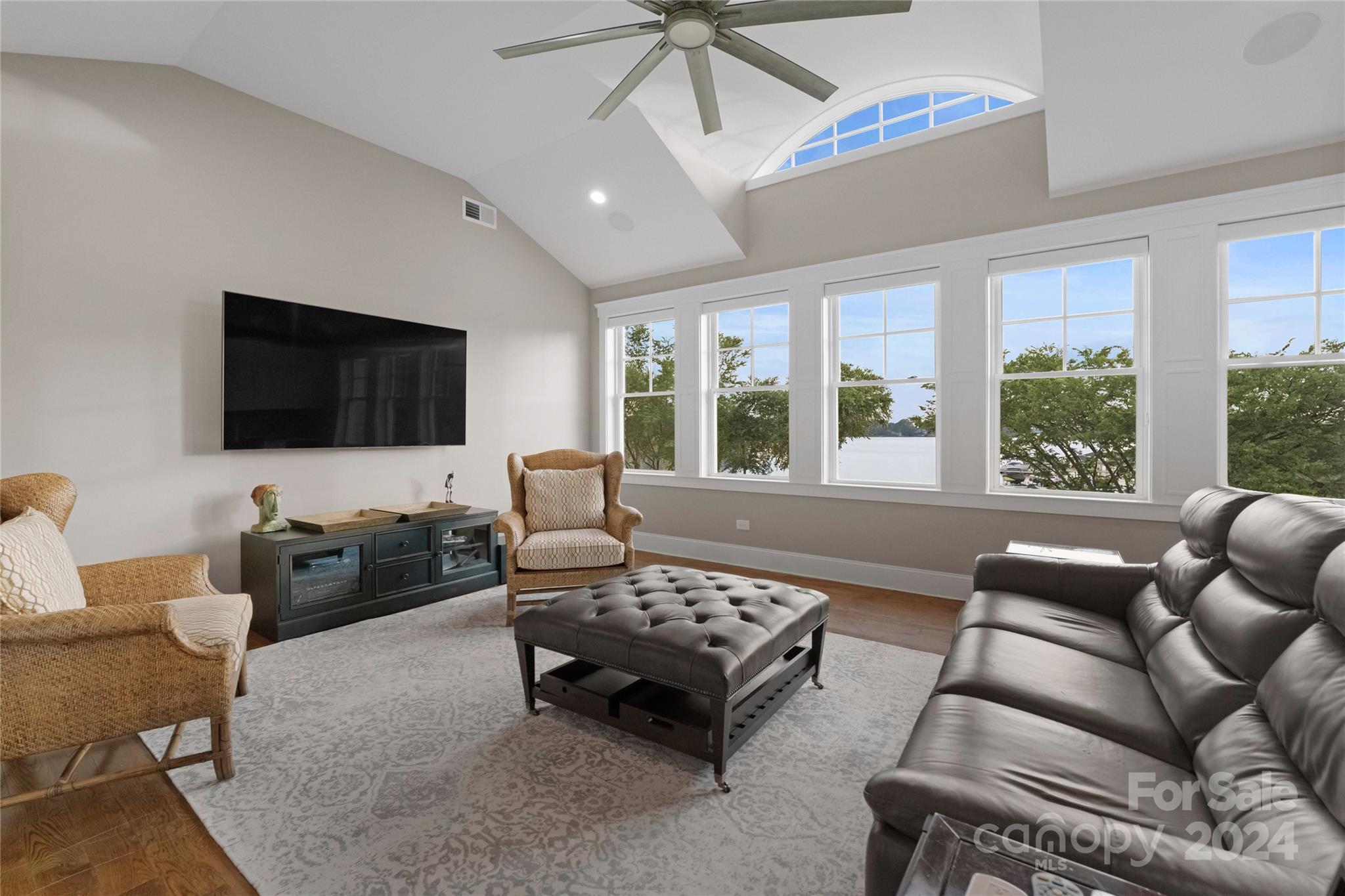 18121 John Connor Road Cornelius, NC 28031 - Photo 21 of 43 a living room with furniture and a flat screen tv