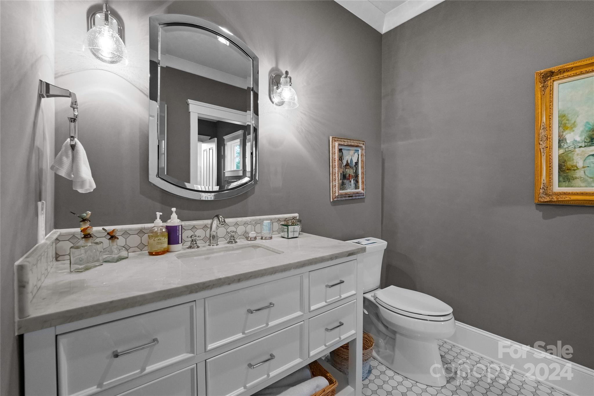 18121 John Connor Road Cornelius, NC 28031 - Photo 26 of 43 a bathroom with a toilet sink and mirror