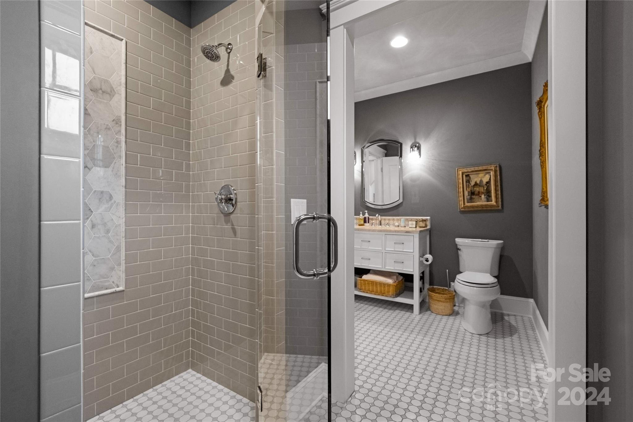 18121 John Connor Road Cornelius, NC 28031 - Photo 28 of 43 a bathroom with a toilet a sink and shower