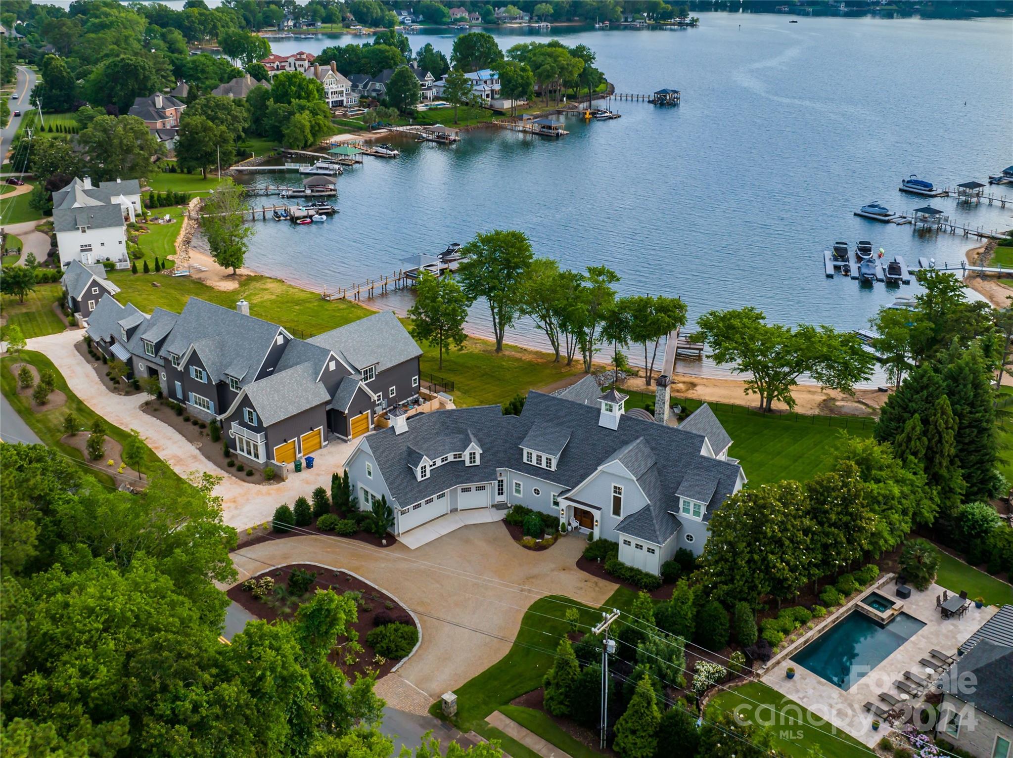 18121 John Connor Road Cornelius, NC 28031 - Photo 43 of 43 an aerial view of residential houses with outdoor space and lake view