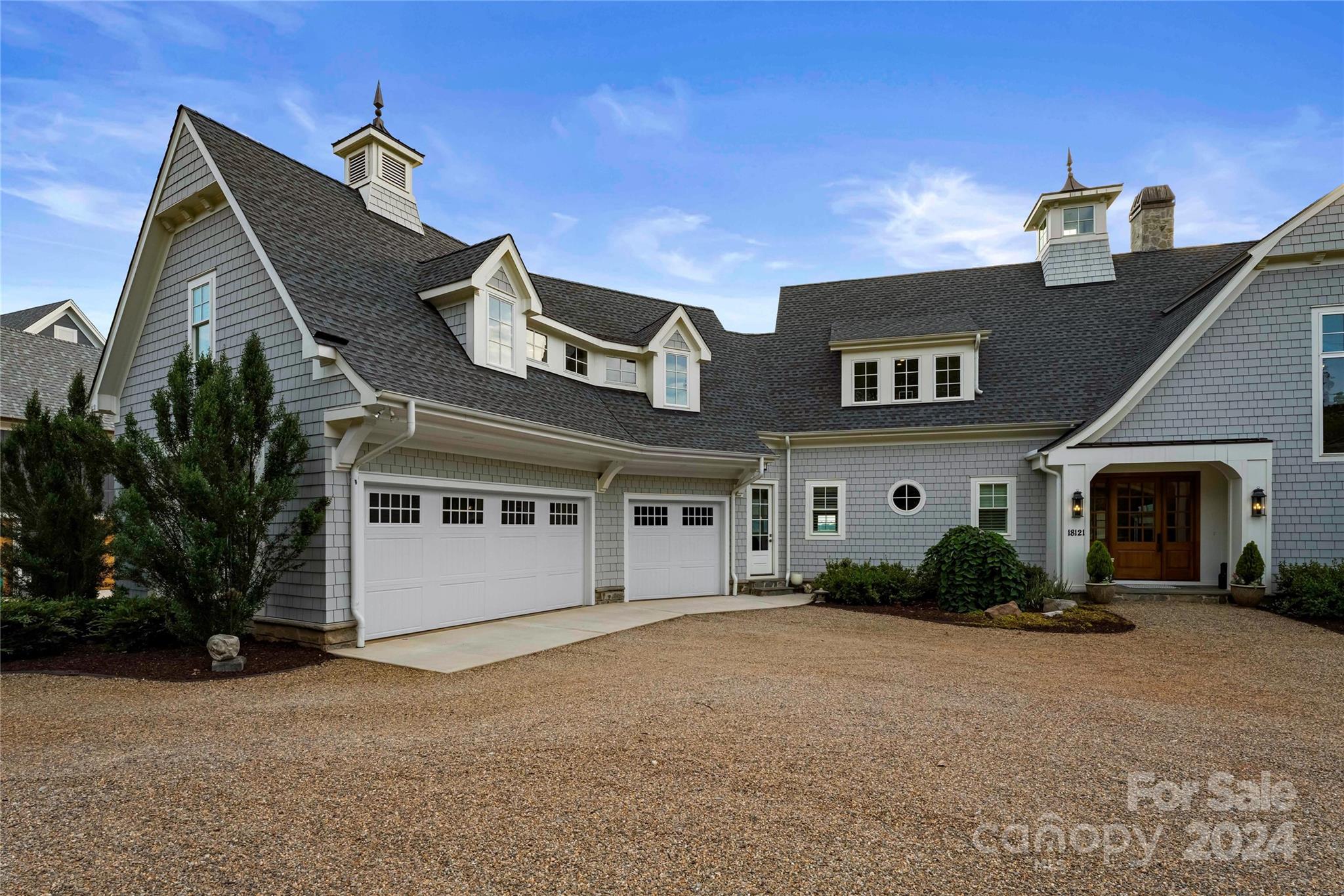 18121 John Connor Road Cornelius, NC 28031 - Photo 5 of 43 a front view of a house with garden