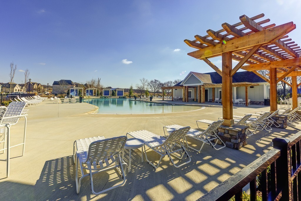 320 Huron Drive Thompson's Station, TN 37179 - Photo 9 of 16 a view of a lake with a table and chairs