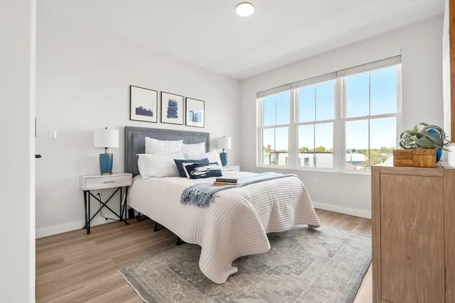 a bed room with a bed and a window