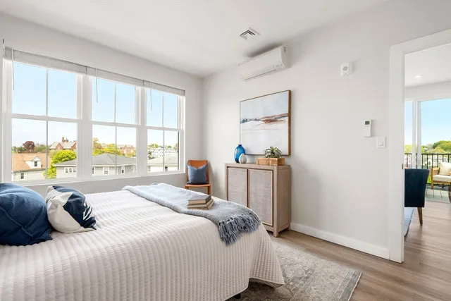 a bedroom with a bed furniture and a window