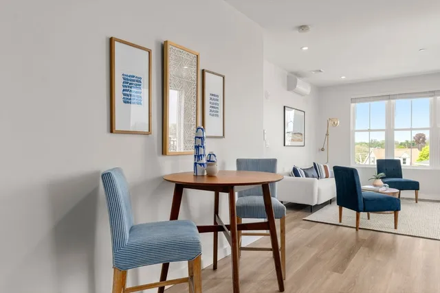 a view of a livingroom with furniture and window