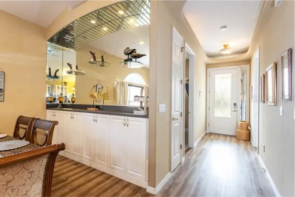 a view of a dining room with furniture and wooden floor