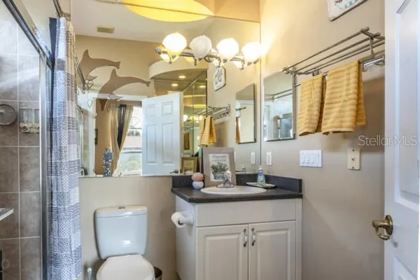 a bedroom with double bed and a window