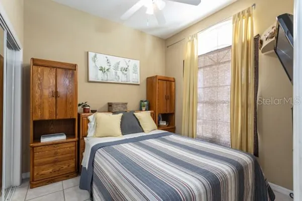 a bedroom with a large bed and a window