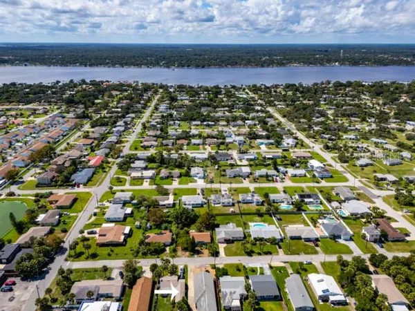 an aerial view of residential houses with outdoor space