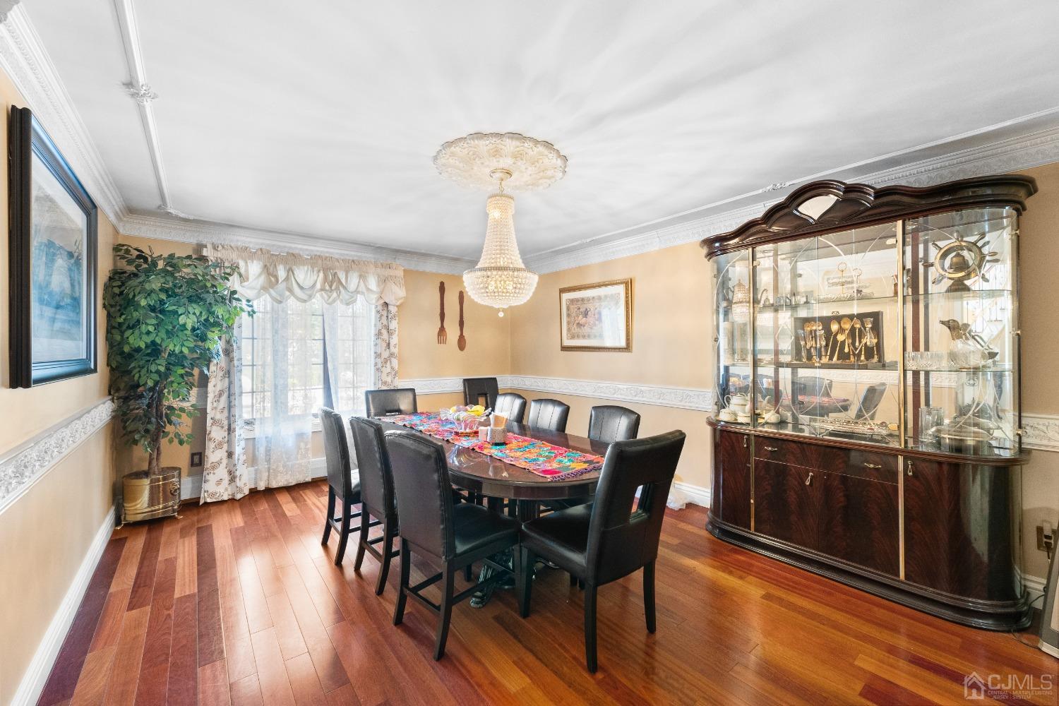 16 Parson Place Colonia, NJ 07067 - Photo 13 of 70 a view of a dining room with furniture window and wooden floor