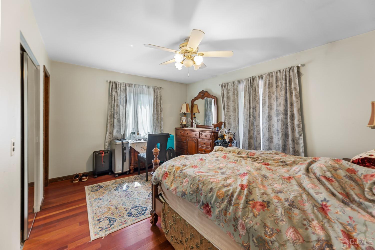 16 Parson Place Colonia, NJ 07067 - Photo 28 of 70 a bedroom with a bed and a chandelier