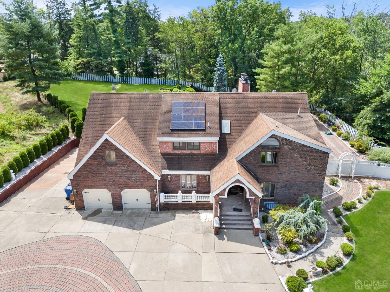 16 Parson Place Colonia, NJ 07067 - Photo 3 of 70 an aerial view of a house with a yard and potted plants