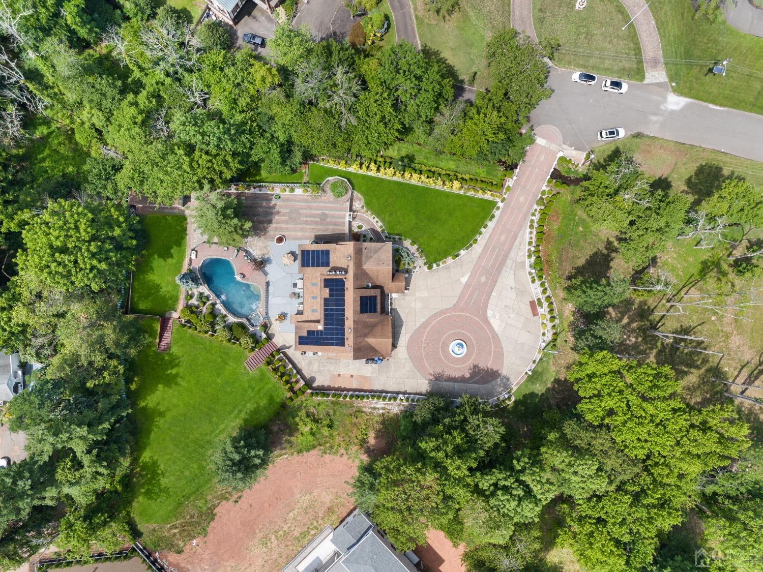 16 Parson Place Colonia, NJ 07067 - Photo 4 of 70 an aerial view of a house with a garden and trees
