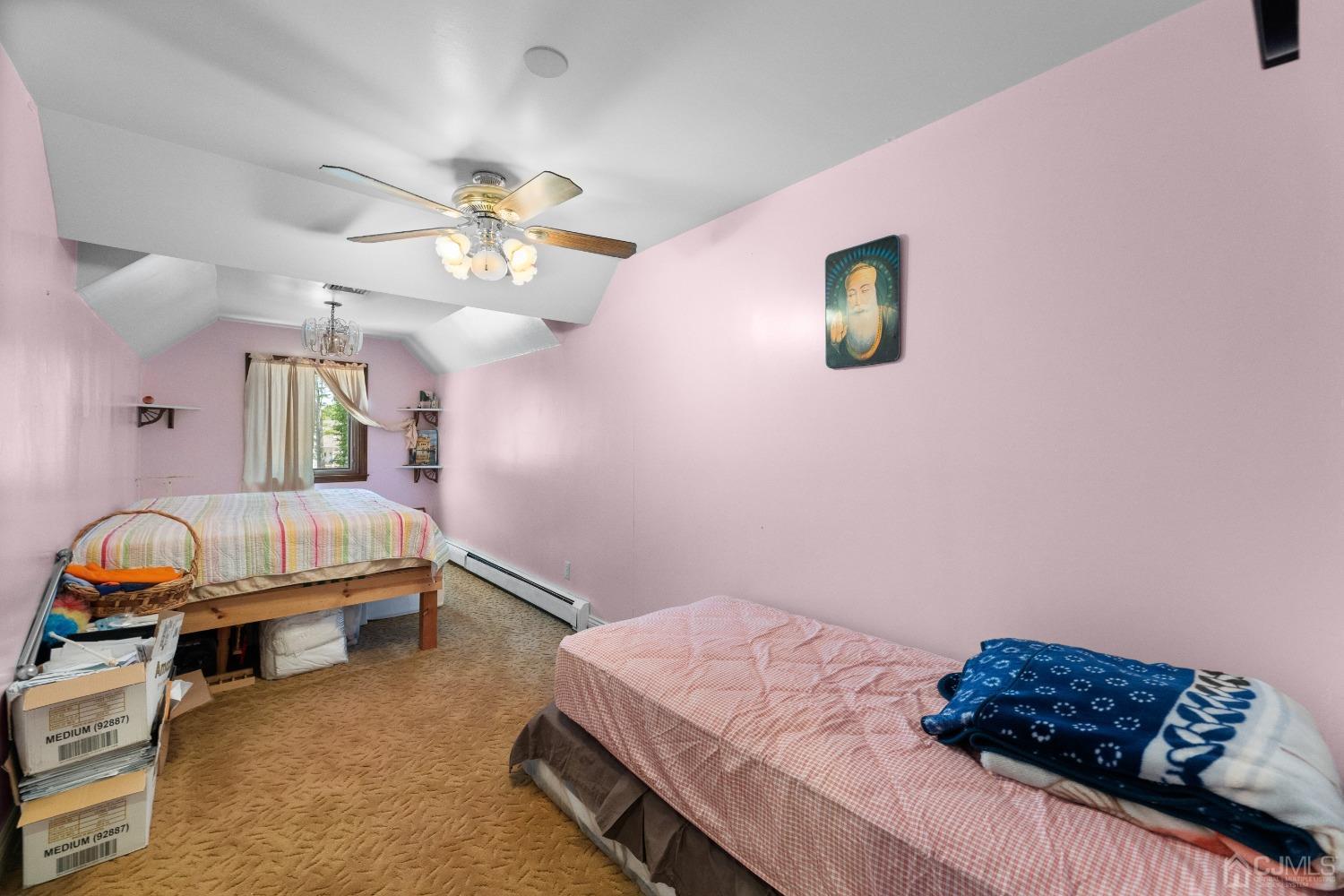 16 Parson Place Colonia, NJ 07067 - Photo 42 of 70 a bedroom with a bed and a chandelier