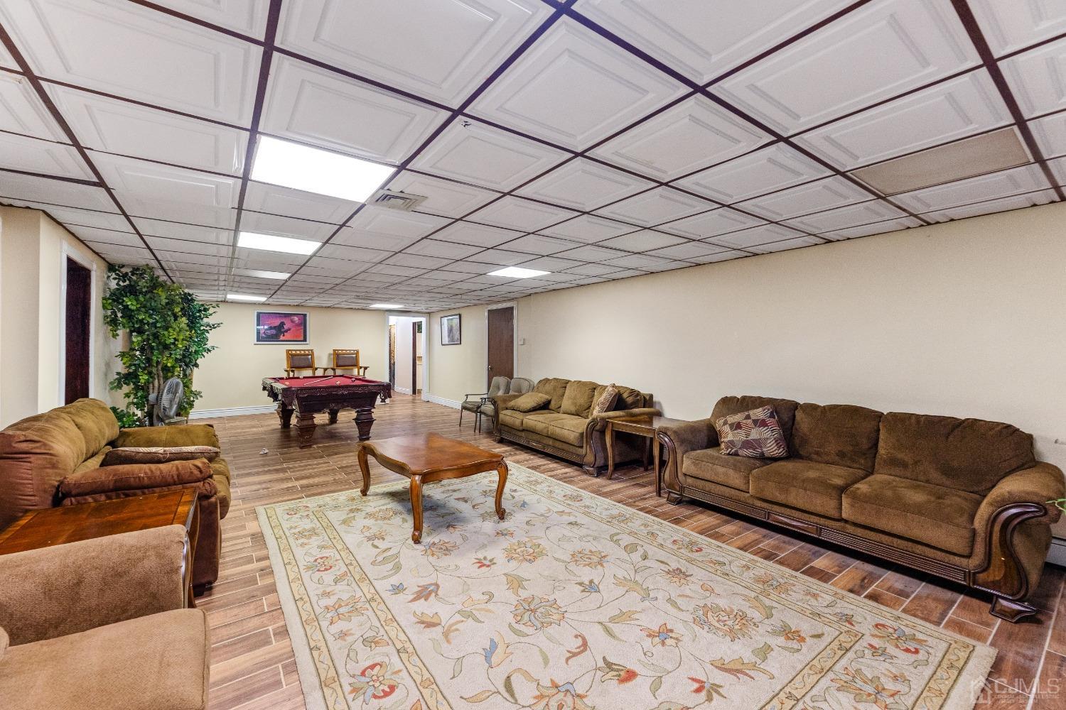 16 Parson Place Colonia, NJ 07067 - Photo 47 of 70 a living room with furniture a couch and a table