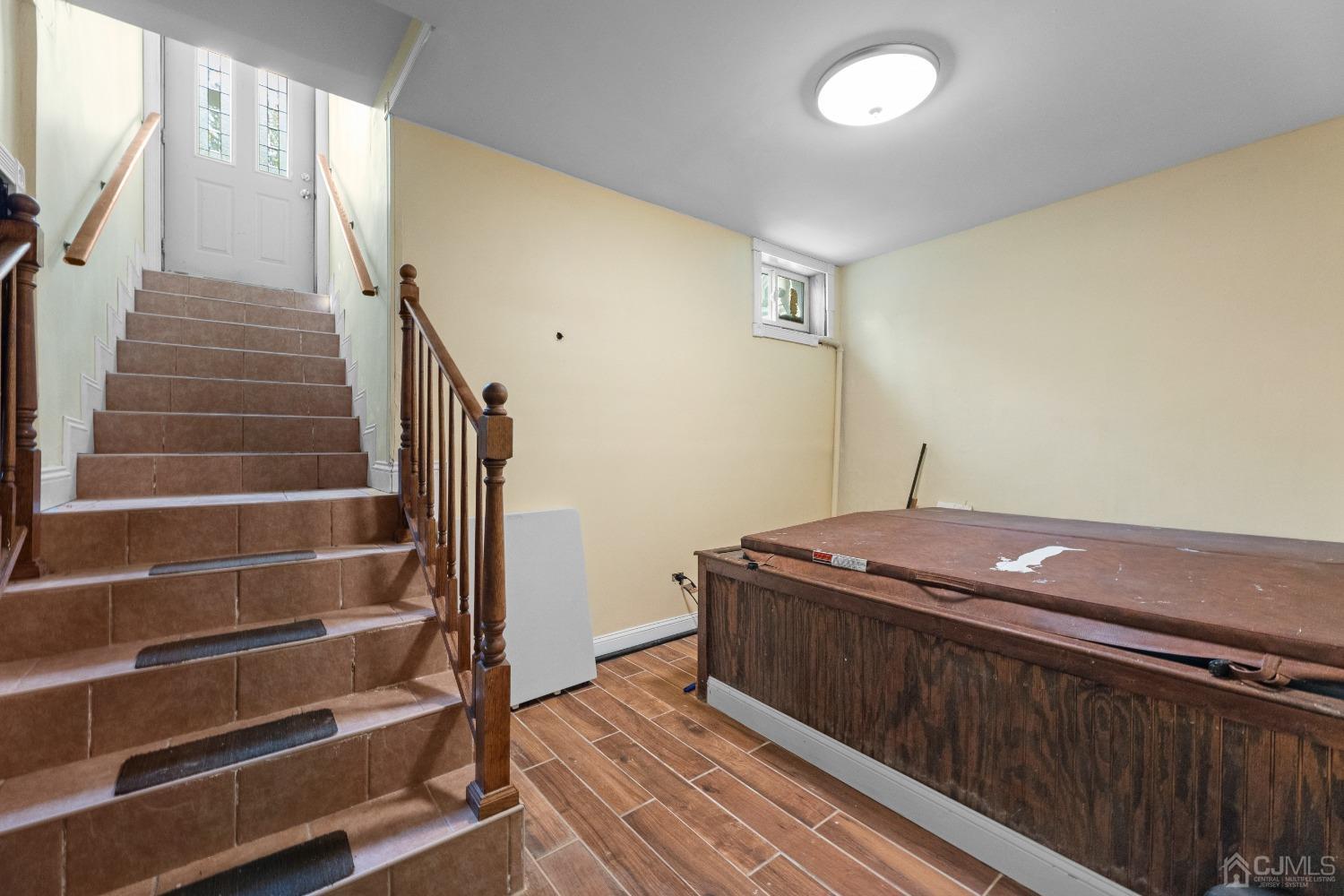 16 Parson Place Colonia, NJ 07067 - Photo 48 of 70 a view of bedroom with stairs and wooden floor