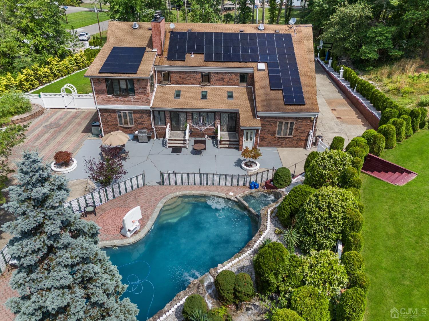 16 Parson Place Colonia, NJ 07067 - Photo 66 of 70 an aerial view of a house with a garden