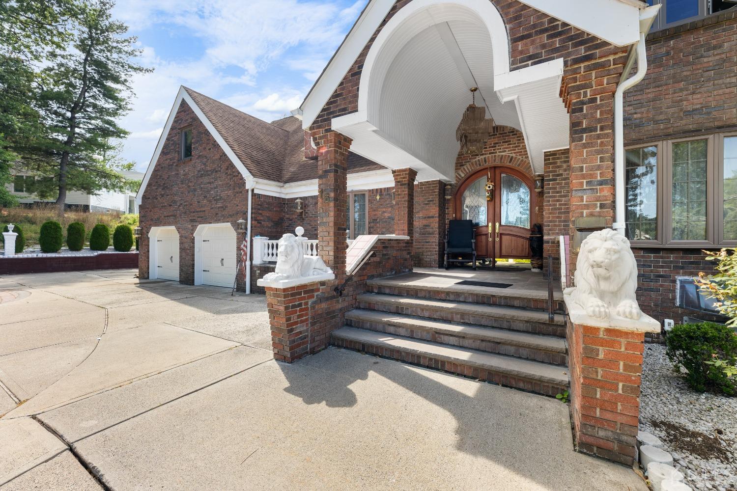 16 Parson Place Colonia, NJ 07067 - Photo 10 of 70 a front view of a house with a garden