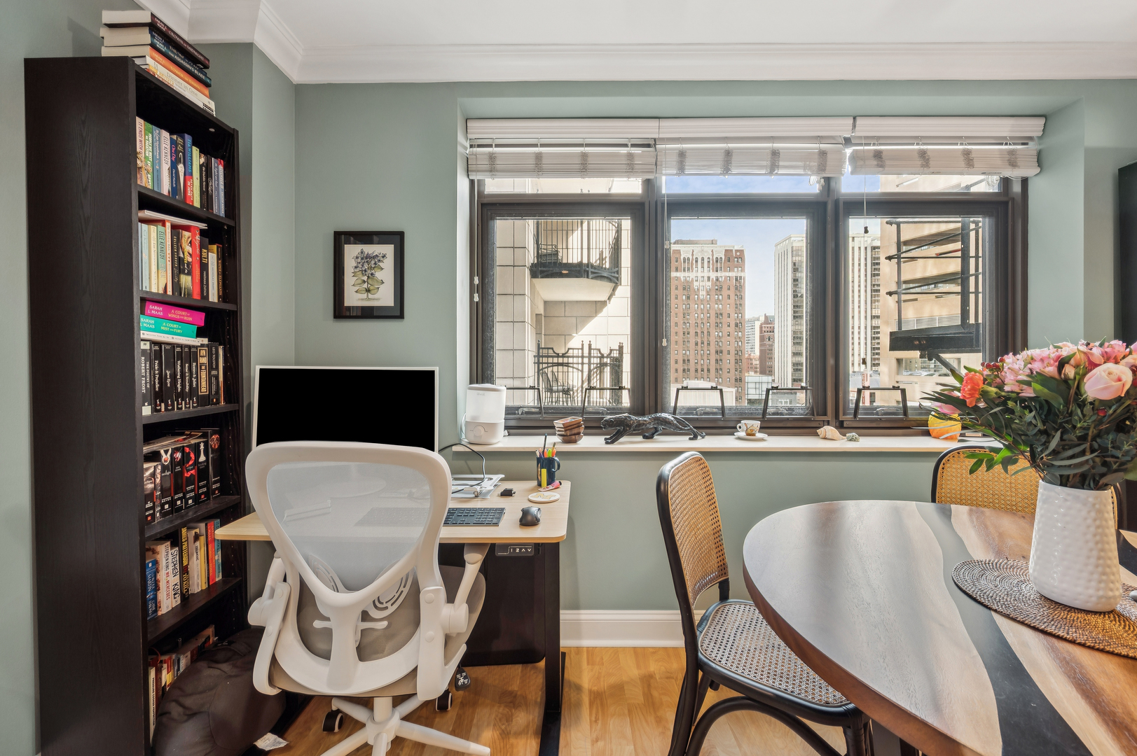 40 East Delaware Place, Unit 904 Chicago, IL 60611 - Photo 12 of 20 a view of a dining room with furniture window and wooden floor