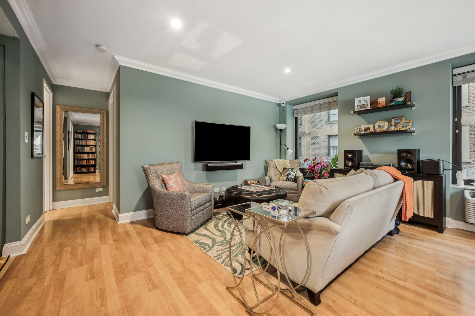 40 East Delaware Place, Unit 904 Chicago, IL 60611 - Photo 6 of 20 a living room with furniture and a flat screen tv