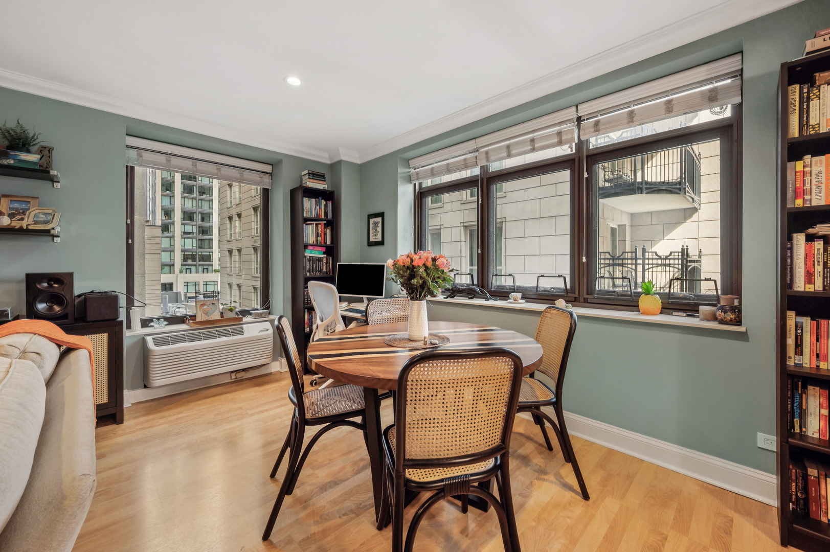 40 East Delaware Place, Unit 904 Chicago, IL 60611 - Photo 8 of 20 a dining room with furniture a chandelier and wooden floor