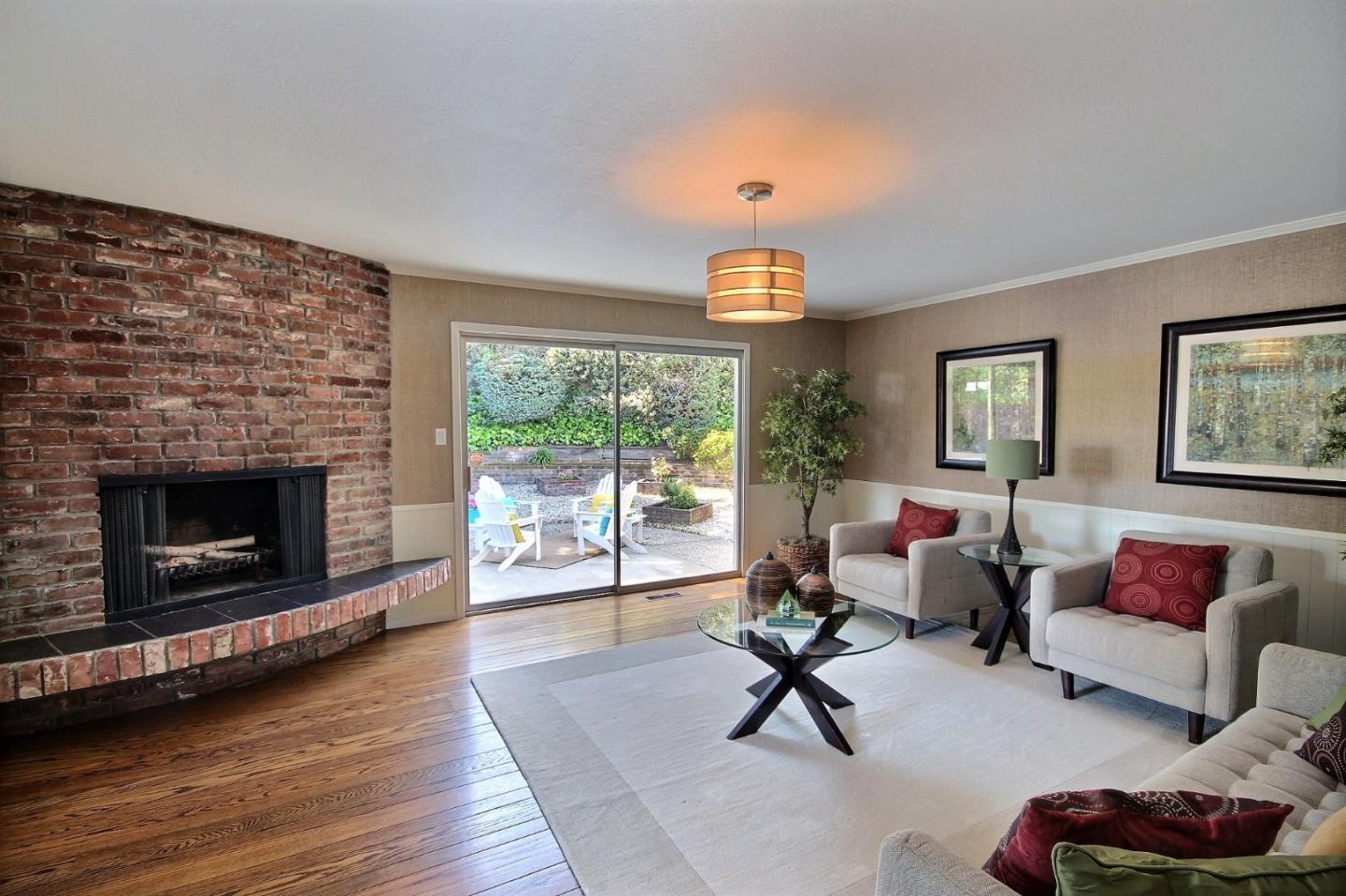 1817 Hunt Drive Burlingame, CA 94010 - Photo 11 of 20 a living room with furniture and a fireplace
