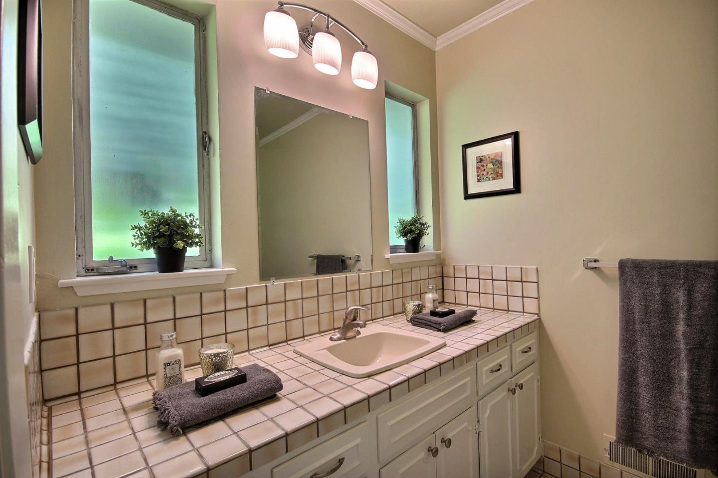 1817 Hunt Drive Burlingame, CA 94010 - Photo 17 of 20 a bathroom with a sink and a mirror