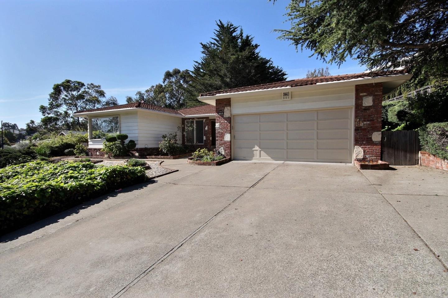 1817 Hunt Drive Burlingame, CA 94010 - Photo 20 of 20 a view of a house with a yard and garage